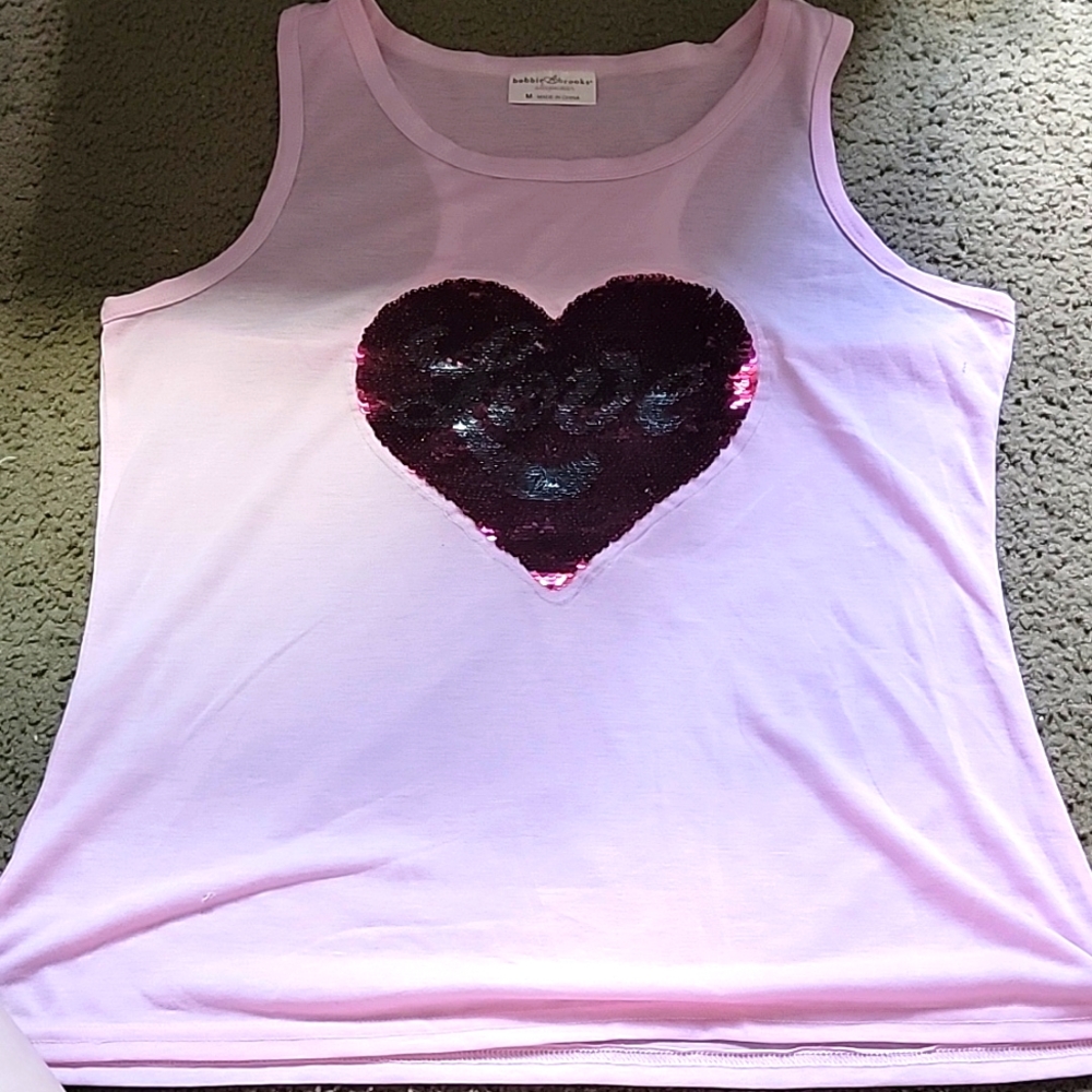 Light pink tank top size medium could fit large